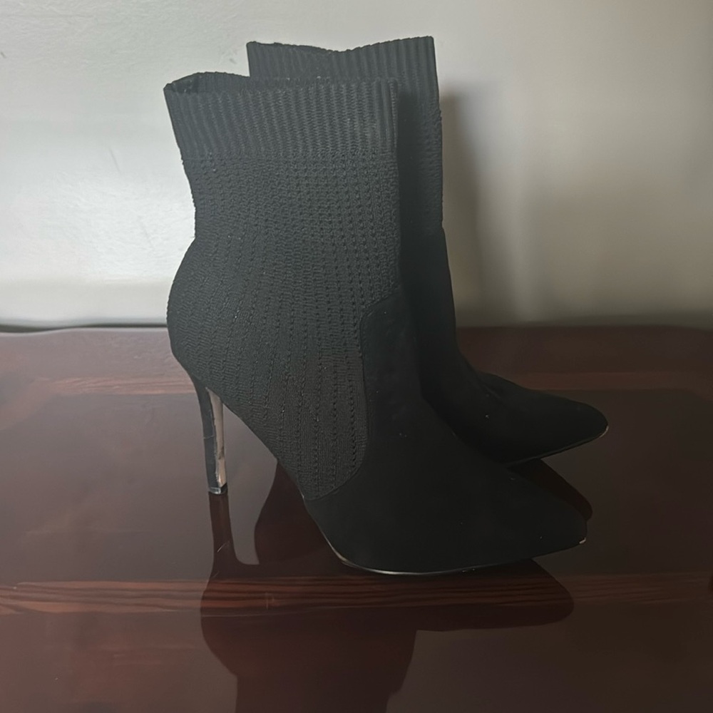 Women’s 4” High heel boot. Slightly worn but in good condition.